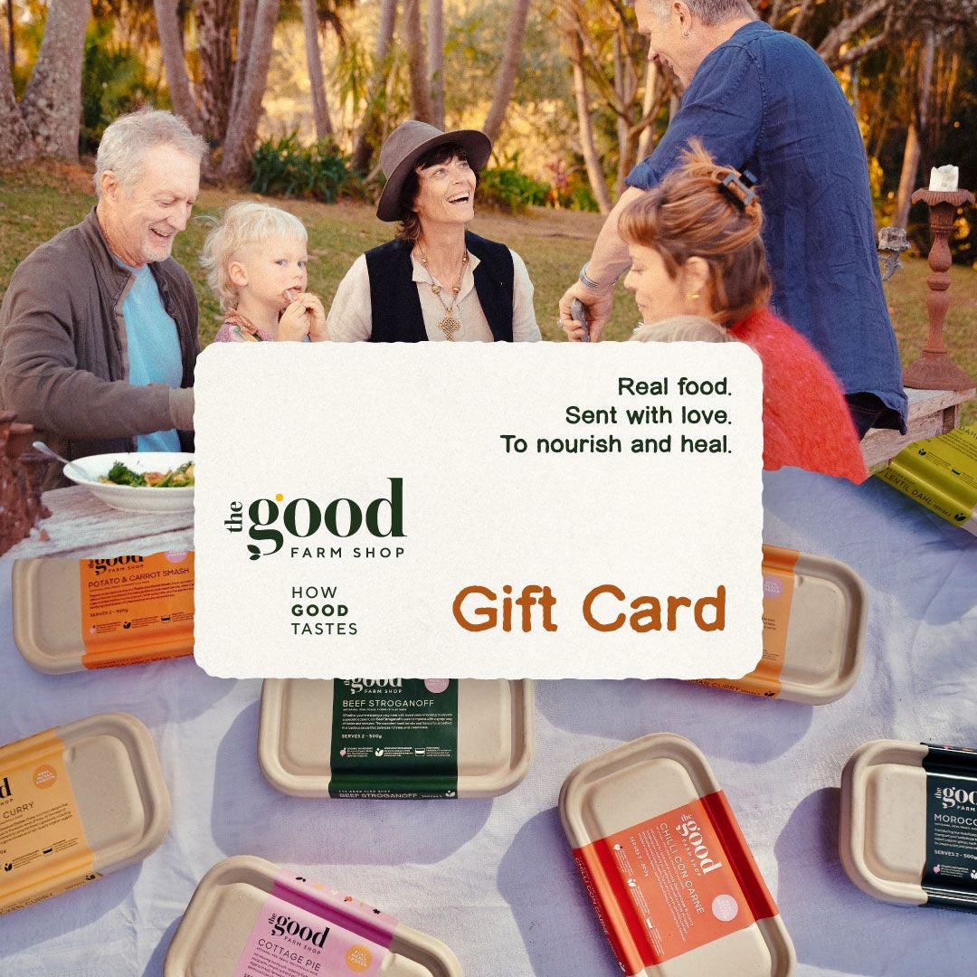 The Good Farm Shop Gift Card with packaged meals and family eating food