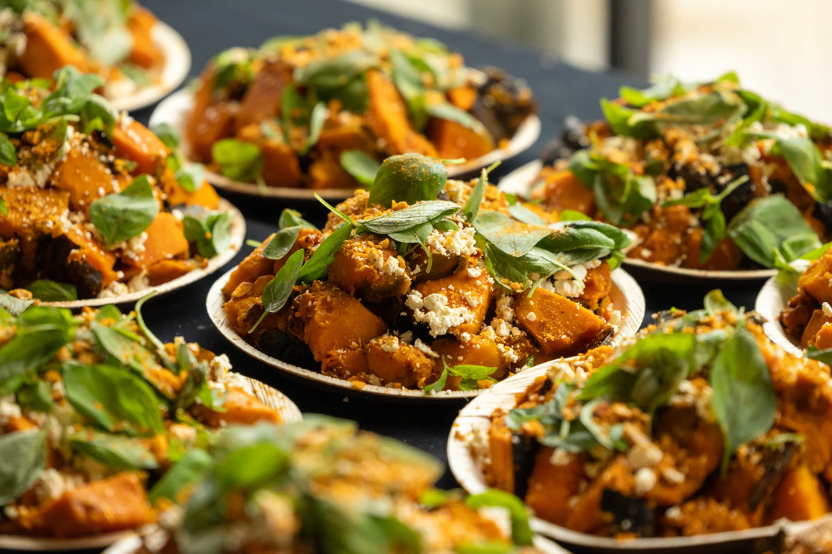 Dishes of food with herbs on a table