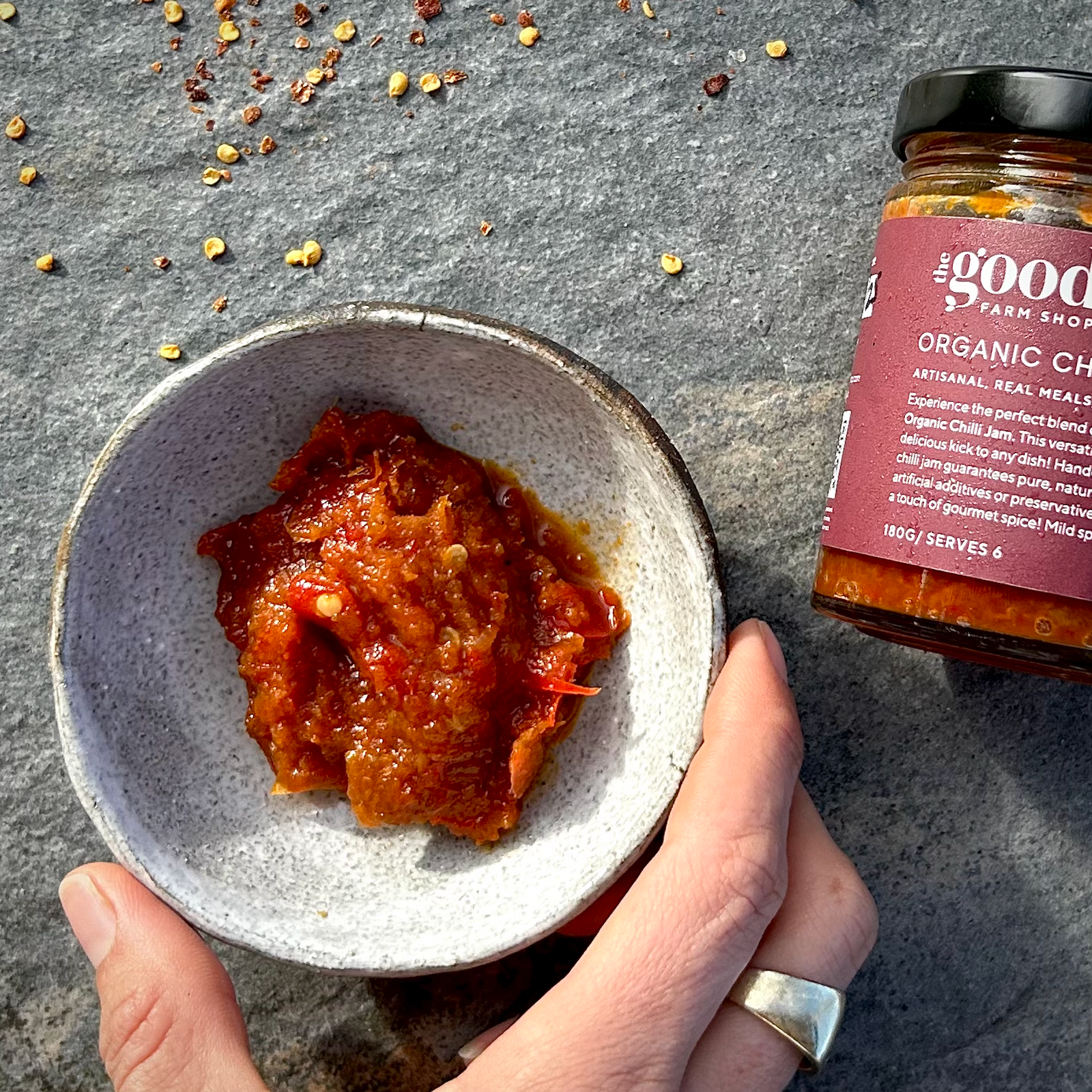 The Good Farm Shop chilli jam in a jar and a small rustic bowl 